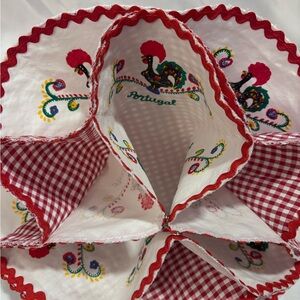 Portugal roll warmer. Colorful Embroidered Fabric with Red Accents